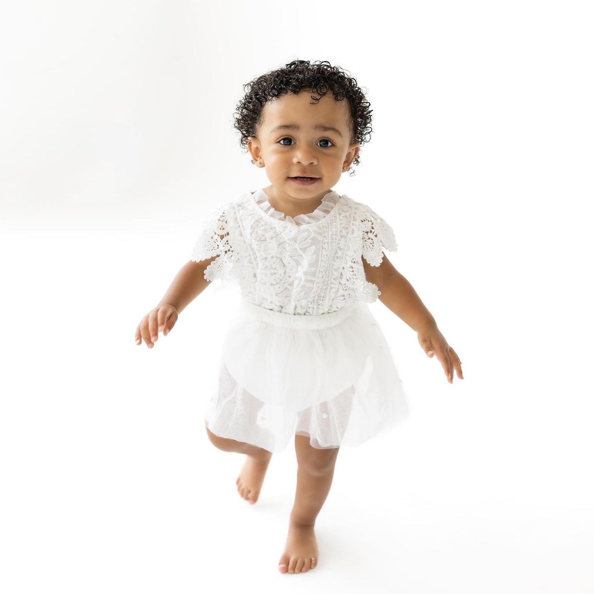 White lace romper for newborn.