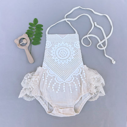 Beige lace baby girl romper for summer holidays.