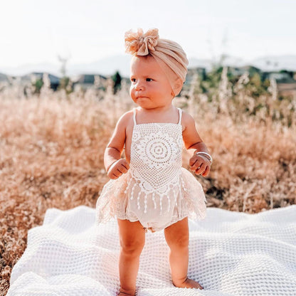 Beige lace toddler outfit for a Summer photoshoot.