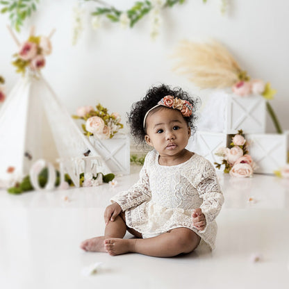 White lace romper for Newborn photoshoot.